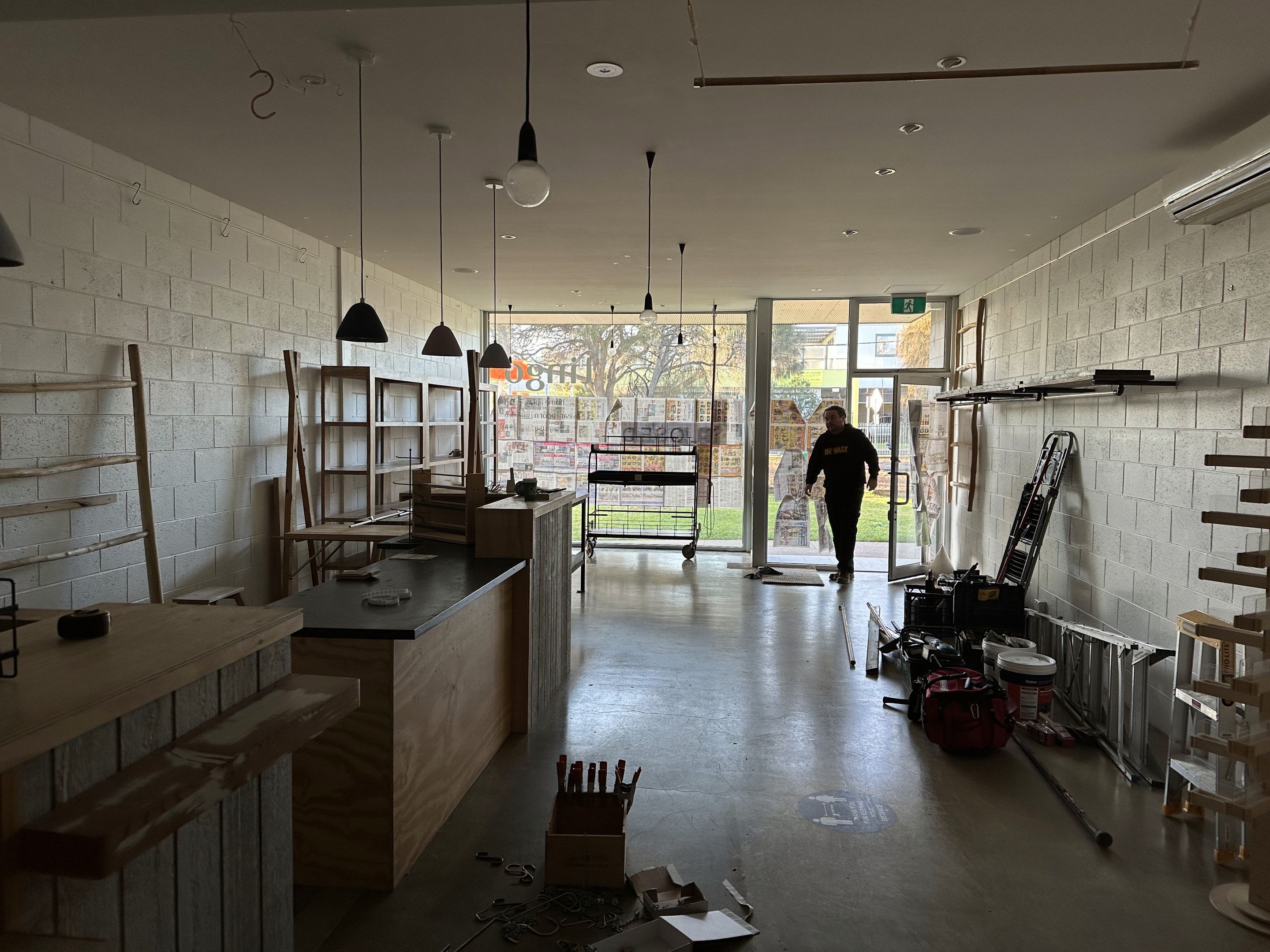 Shopfront entrance mid-fitout, viewed from the street