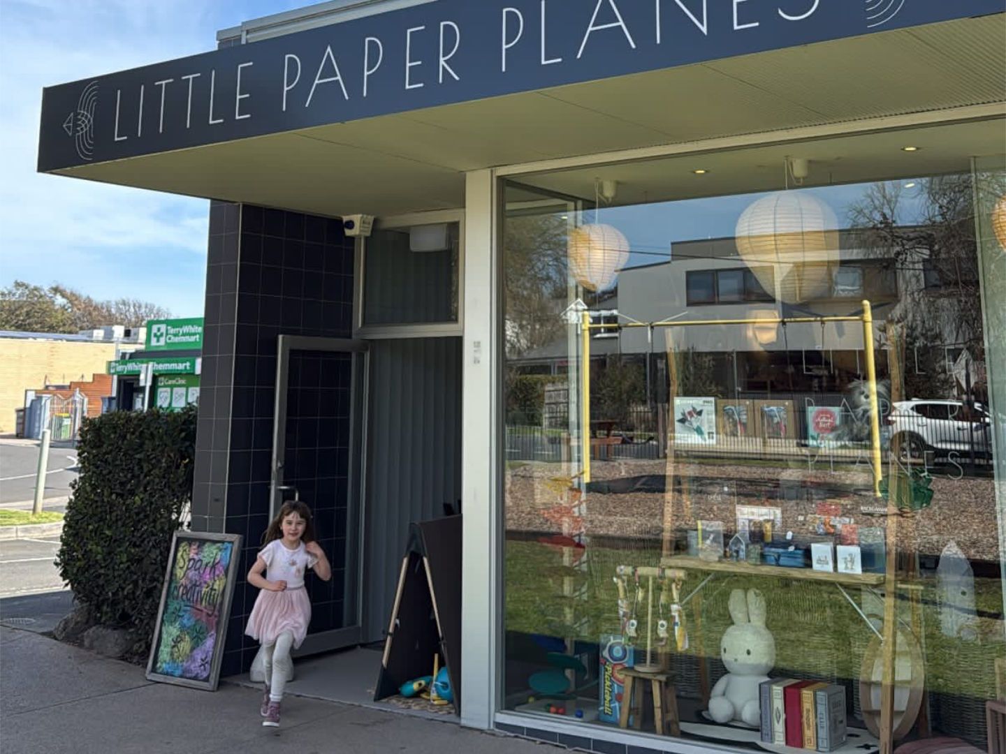 Little Paper Planes shopfront signage and window display from the footpath
